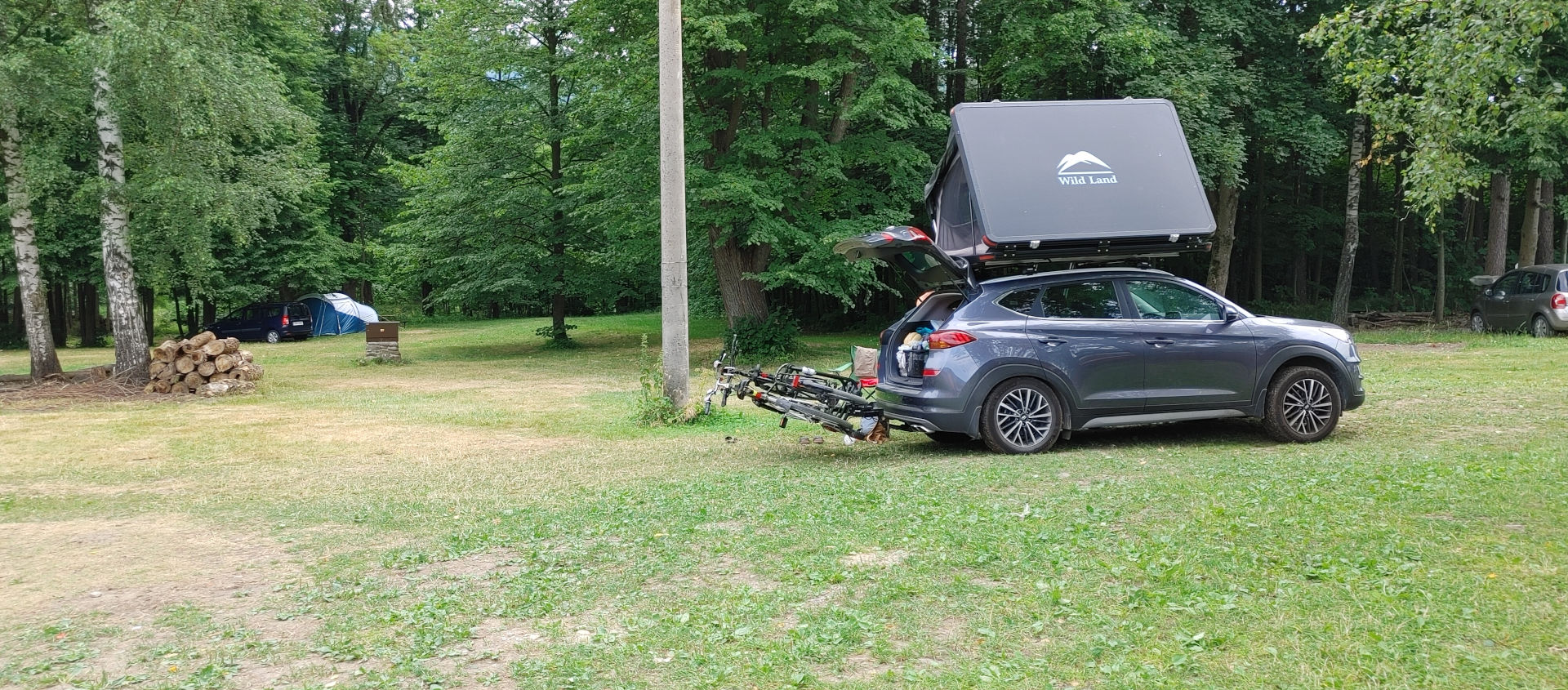 Inside the Wild Land rooftop tent with its mattress, lighting, and anti-condensation mat.