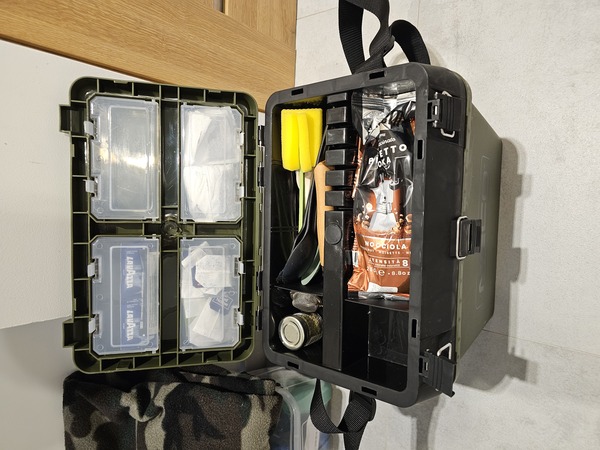 The top compartment of the tackle box with smaller accessories.
