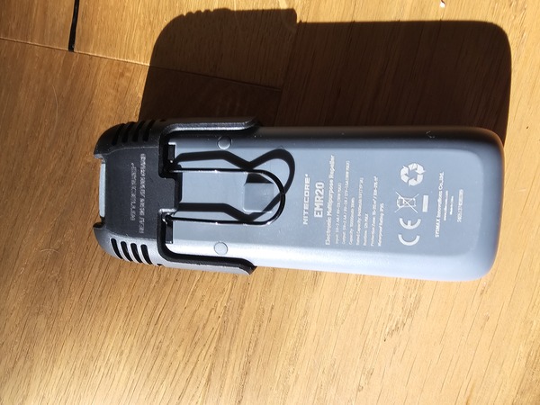The back of the Nitecore device with its attachment clip.