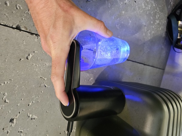 Using the water canister to wash dishes at the campsite.